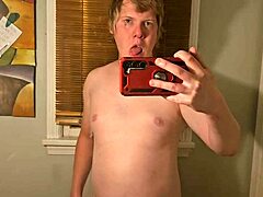 Guy jerks off and cums in gay porn.