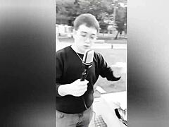 Fat guy bends over to insert microphone in ass