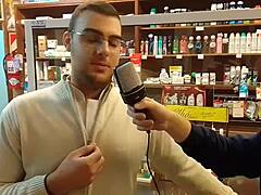 Fat guy bends over to insert microphone in ass