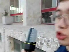 Fat guy bends over to insert microphone in ass