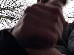 the horny cute european boy steps outdoors in snowy weather, stroking his big dick with intense focus until climax.
