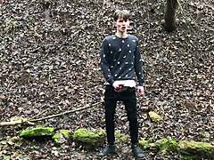 the horny cute european boy steps outdoors in snowy weather, stroking his big dick with intense focus until climax.