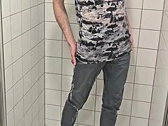 twink plays in shower jeans sneakers fully clothed wet fun