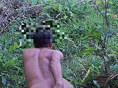 Asian twink fingers tight ass during outdoor solo session