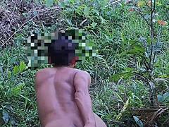 Asian twink fingers tight ass during outdoor solo session