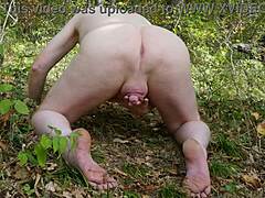 pissing naked outdoors in the forest with red hair