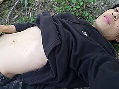 the cute gay twink jerking off his cock pulled through his fly while outdoors is jon arteen 18+